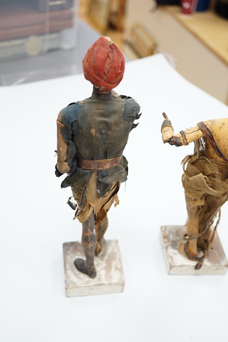 Two Indian clay figures, 26cm high